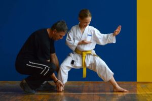 Martial Arts instructor helps student