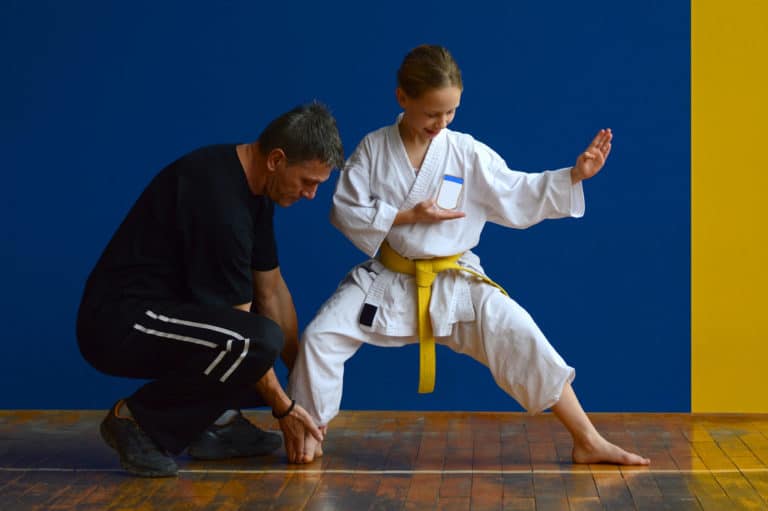 Martial Arts instructor helps student