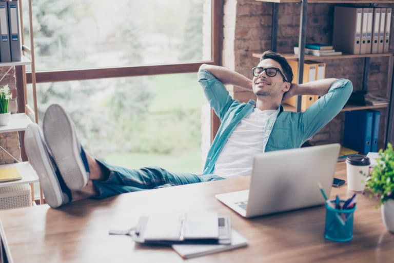 Man on computer relaxed